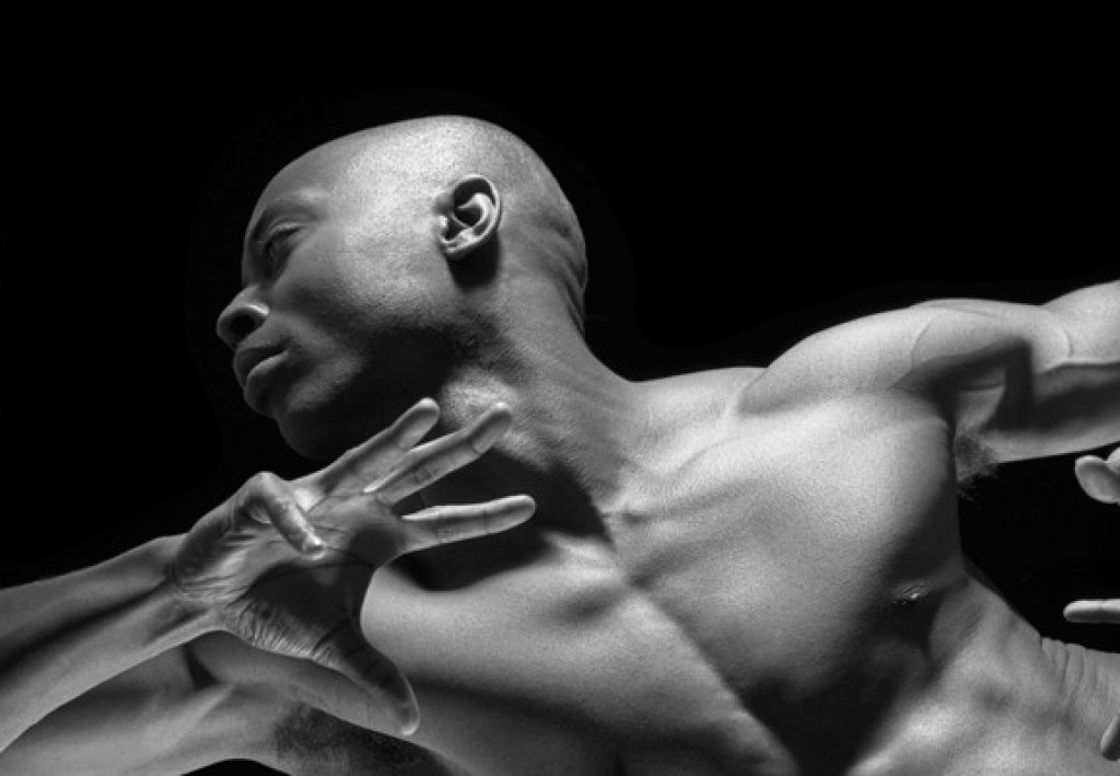 Darren Panton, dancer top half of his body in black and white.